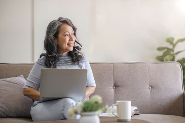 woman working on the couch